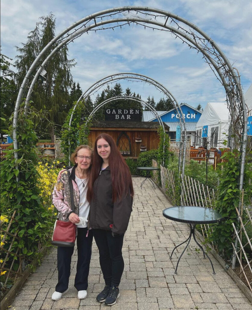 Media and Marketing manager with her grandma Pat are standing at a berry farm in BC. Pat knows how to recognize scams over the phone!